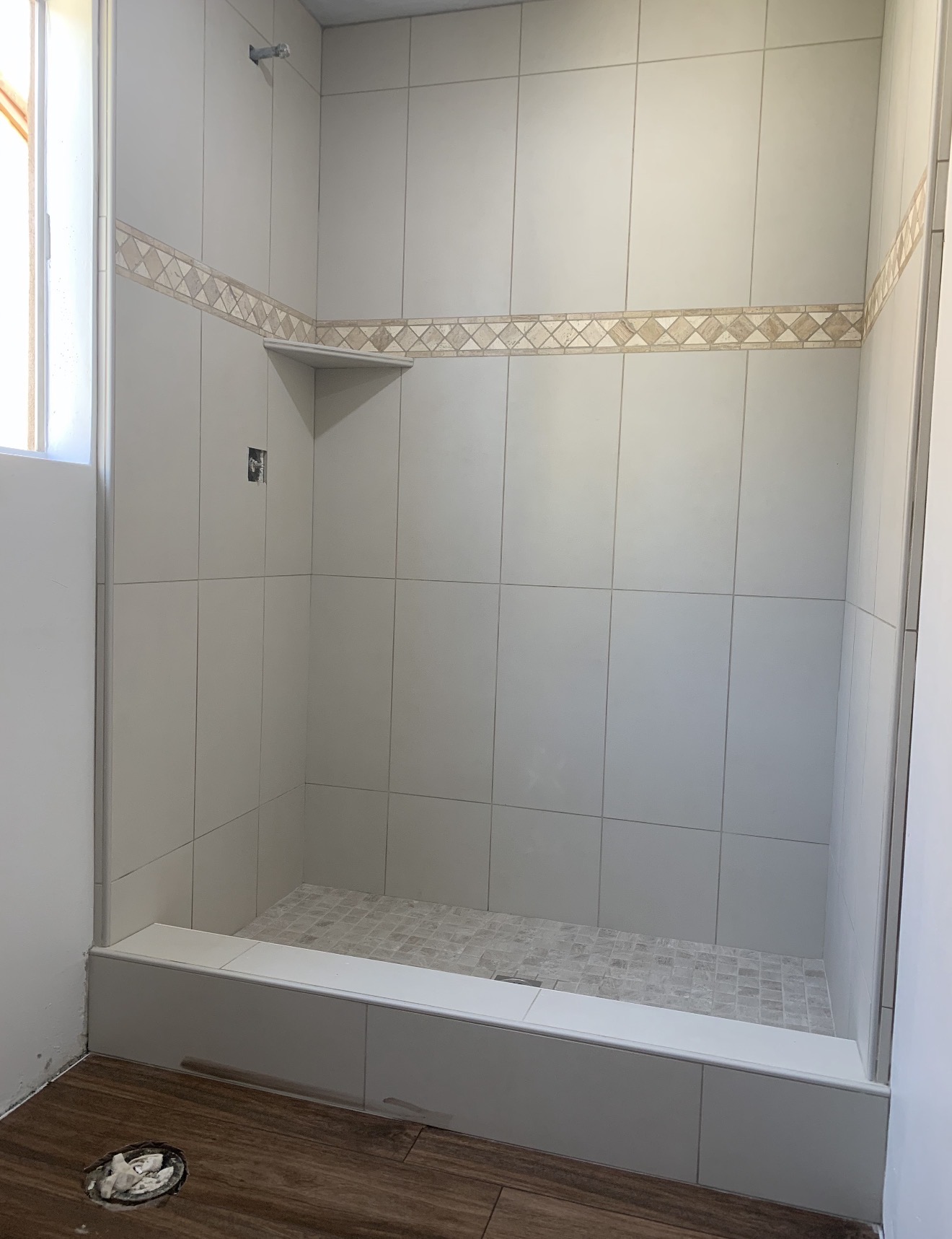 Marble tile walk-in shower installation